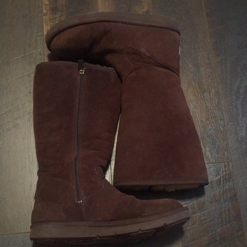 Tall brown Uggs with zipper.